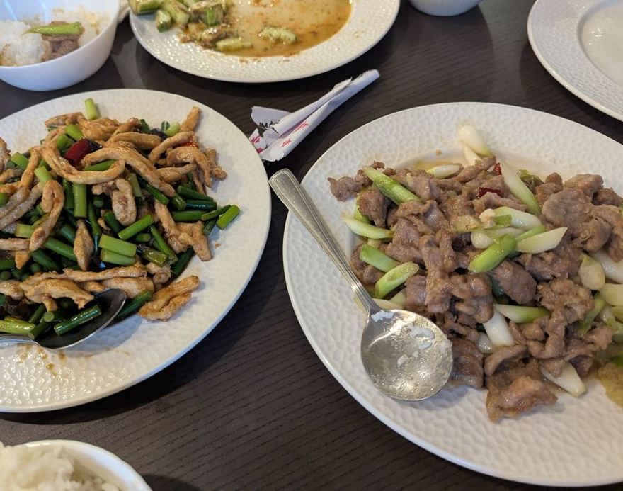Lamb with green onions next to beef with garlic scapes