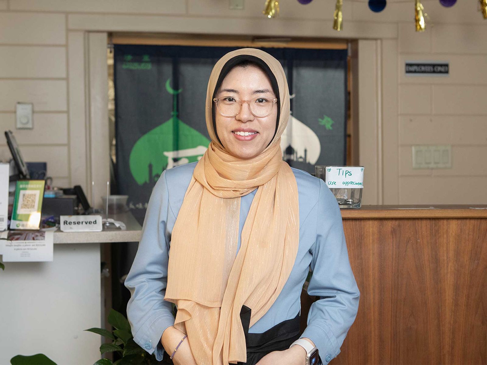 Zahra Yang, owner of YiLan, standing in the dining room